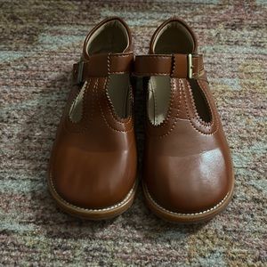 Size 10 brown “leather” Mary jeans.